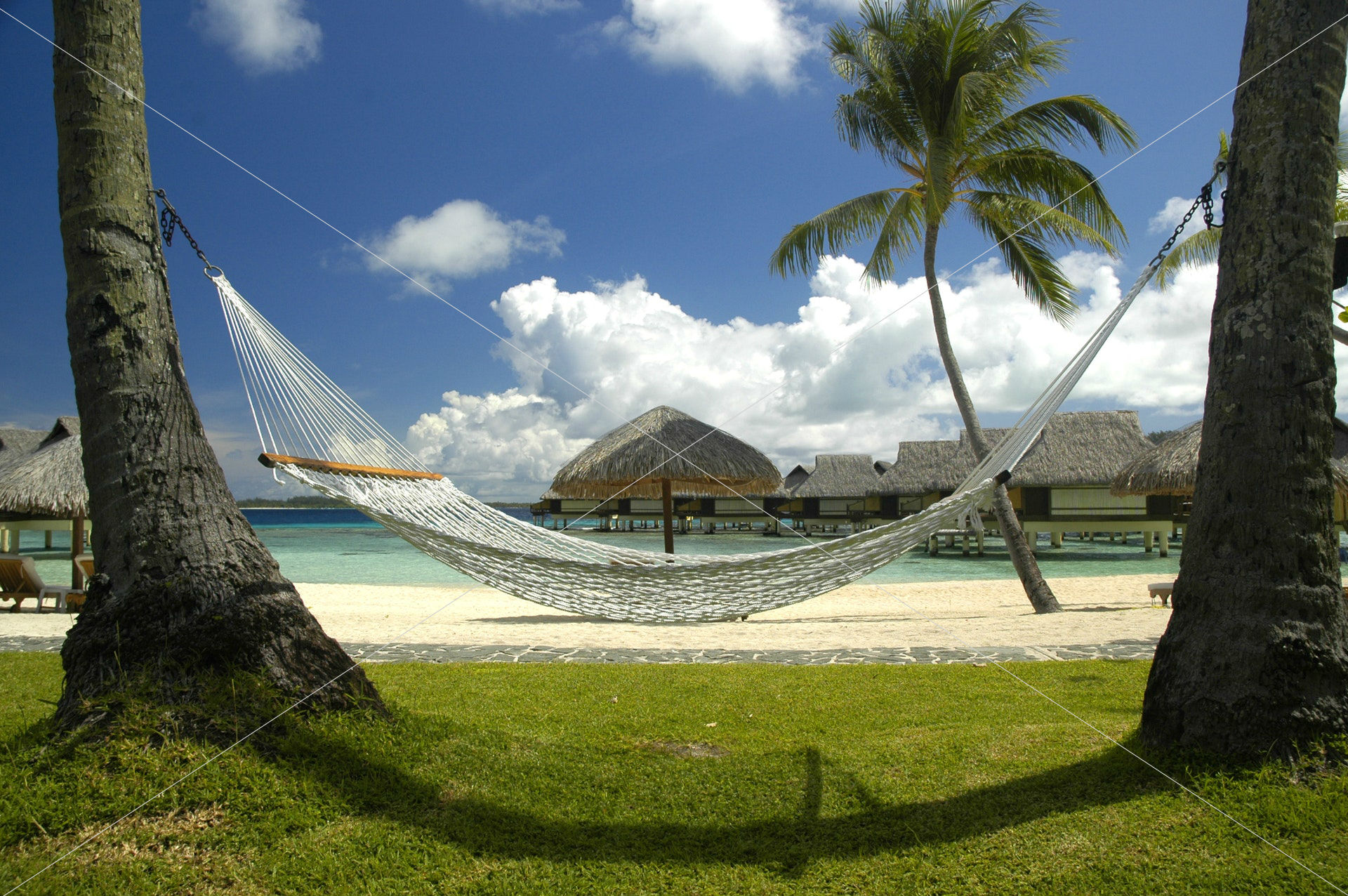 beach-bungalows-clouds-104750
